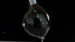 The Beauty of Slow Motion - Why can water drops pass through a soap bubble?