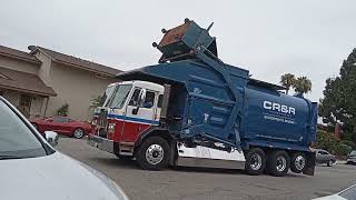 CR&R with overfilled dumpster