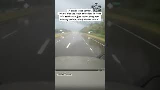 DRIVER LOSES CONTROL ON WET ROAD