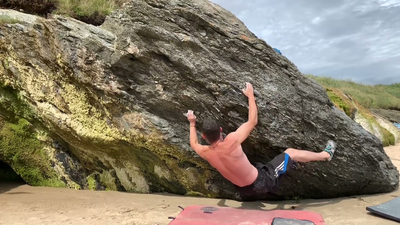 Irish bouldering FA at Magheramore Beach Beach Rhythm 7B