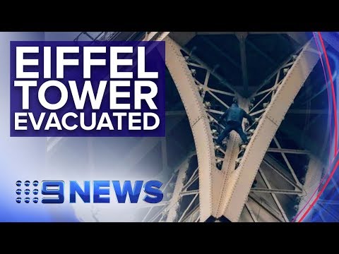 Paris tower locked down as man climbs monument | Nine News Australia