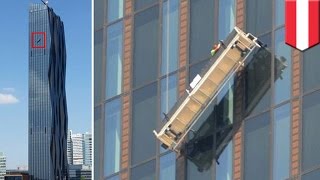 Dangerous jobs: Window cleaners left hanging 48 floors up at Donau City Tower 1 in Vienna, Austria