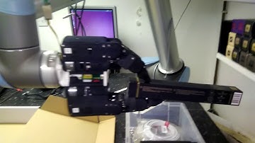 Shadow Modular Grasper packing a box