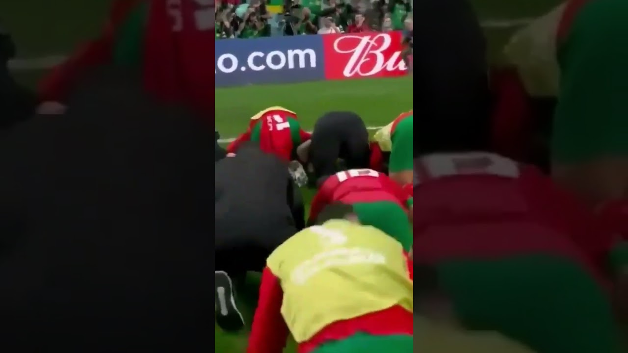 Morocco celebrates victory against Spain on field as they advance to quarterfinals. 🇲🇦☝🏽 