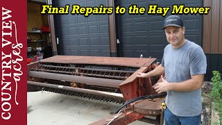 Replacing broken floatation spring in the Hesston Hay Mower.  It's now ready to cut hay.