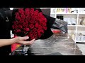 Making of 50 red roses bouquet