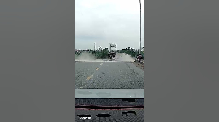 Shocking moment busy bridge COLLAPSES in northern Vietnam