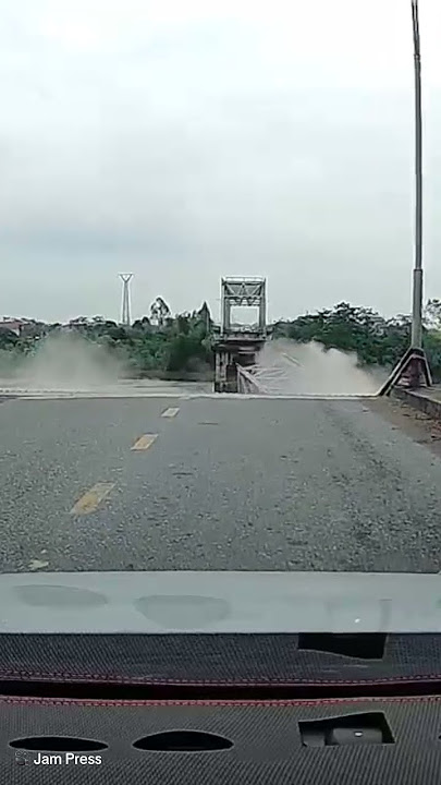 Shocking moment busy bridge COLLAPSES in northern Vietnam