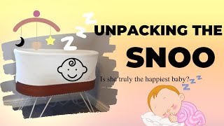 Unpacking baby's bed. The snoo from the happiestbaby.com Wealth