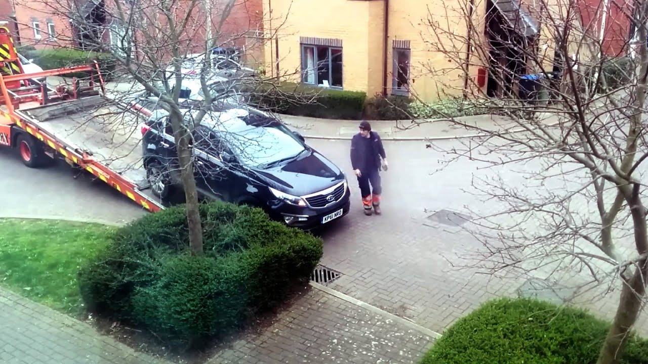 Woman's car is towed away for being an obstruction - YouTube