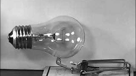 Light bulb in mouse trap in slow motion