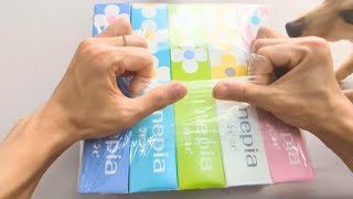 Hands wondering which new tissue box to choose.ASMR