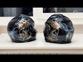 Airbrushing skulls on motorcycle helmet