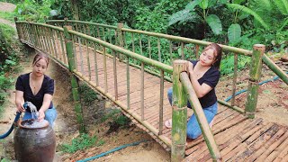 Build a bamboo bridge across the stream to the wooden house in the forest