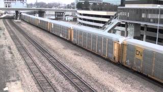 BNSF #7649 leads WB Stacktrain  and UP #6044 leads WB Autoracks. Kansas City. MO 12/12/15