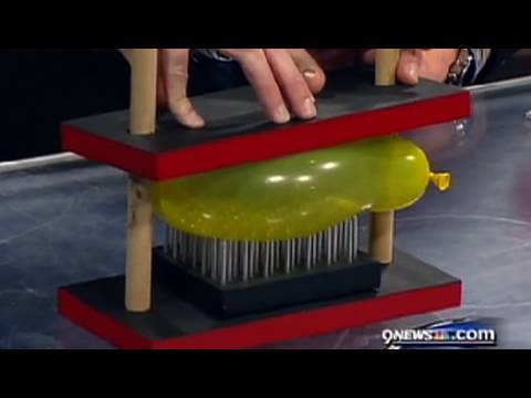 The science of lying down on a bed of nails. - YouTube