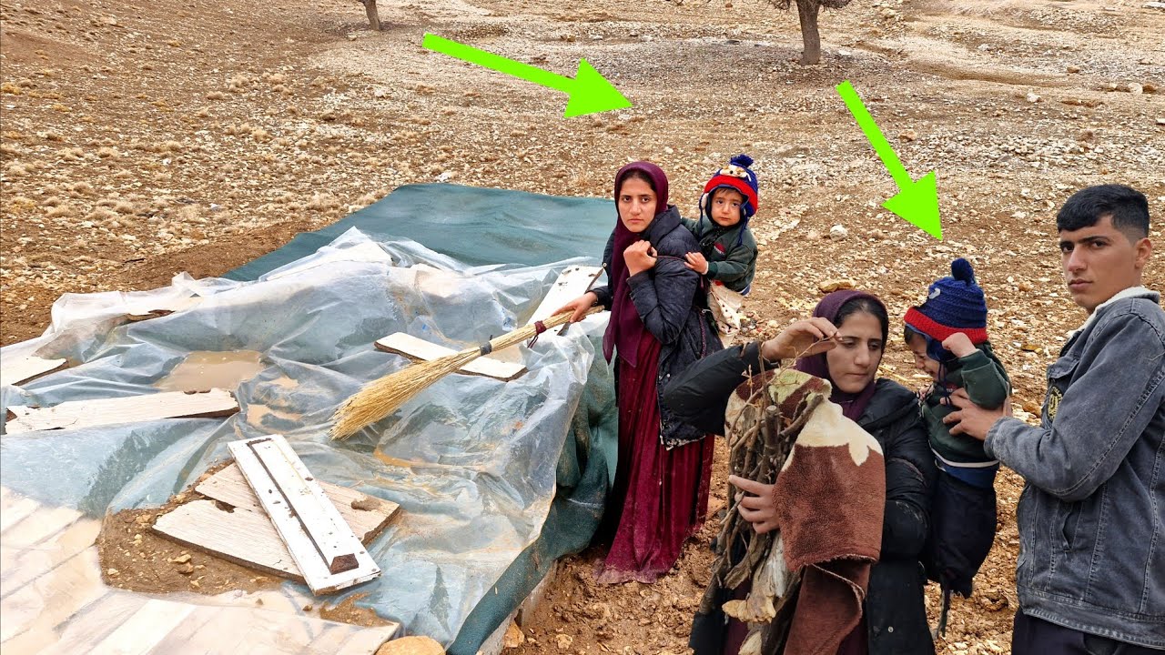 Young nomadic mother and her baby in the battle against the mountain blizzard