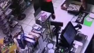 Watch a criminal apply a card skimmer inside a convenience store