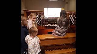 Ukrainian children being allowed to play the Organ after the concert.