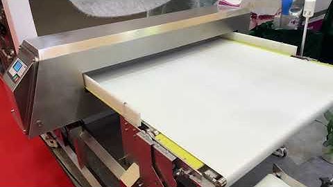 wide conveyor type metal detector with retractable rejection system 1