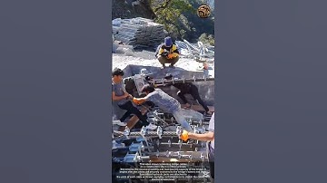 The process of tensioning bridge cables on a construction site