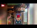 Lads try to outdo each other by kicking punch machine