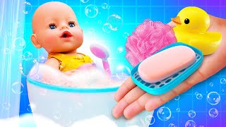 Toy washing machine & bath time in a toy bathtub with baby dolls. Kids pretend to play babysitter.