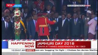 President Uhuru Kenyatta salutes NASA leader Raila Odinga