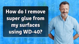 How do I remove super glue from my surfaces using WD-40?
