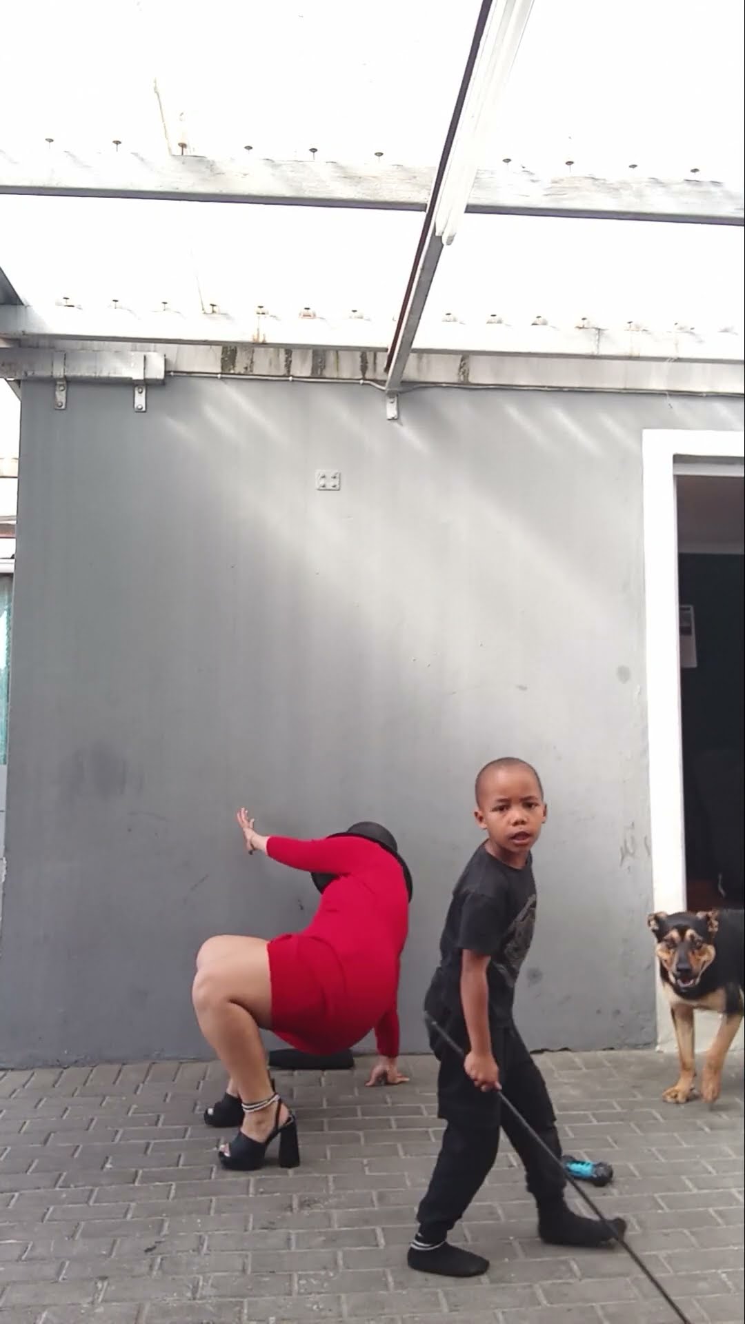 Fit Check Goes Wrong as Woman Trips Over Child Playing on the Floor