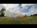 Burning brush pile sets whole field on fire!