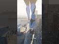 Giantess casually walking through a city