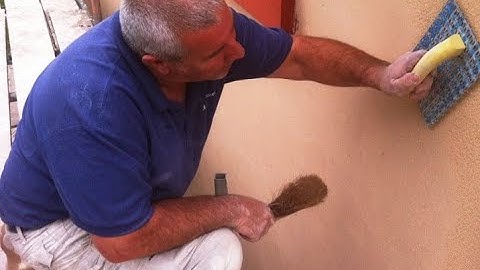 Spray rendering bagging before exterior wall coating to prepare walls