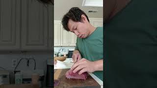Preparing tuna loin into saku block to be used later for sashimi / sushi