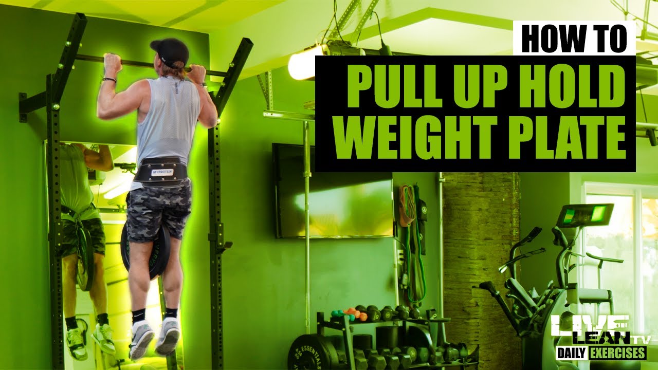 Guy Performing L-sit on Pull Up Bar Flips Weight Plate With Legs