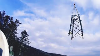 Lineman at Work/ Extreme Jobs/ building transmission line/ using helicopter