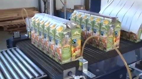 Prasmatic TCS combination wrap around case packer and shrink wrapper by Robopac USA