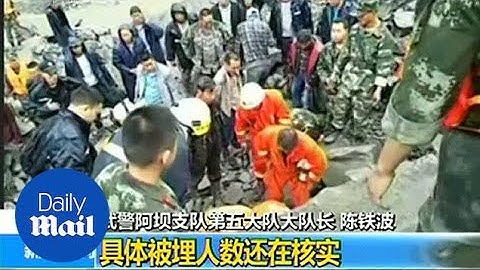 Rescue workers scramble to save victims of landslide in China - Daily Mail