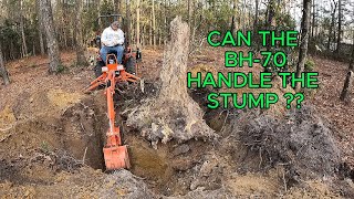 Kubota B2601 And A Big Stump With The Bh-70 Backhoe.