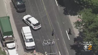 Dump truck hits construction flagger in Forest Hills