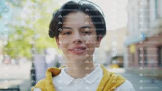 Close-Up Portrait Of Cheerful Teenager Smiling Looking At Camera On Windy Day