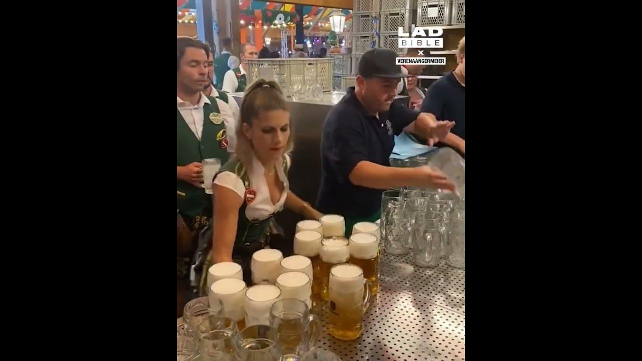 Waitress carries impressive amount of steins Oktoberfest 🍻 #shortvideo #shorts #viral  #viralshorts