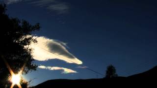 iridescent cirrus cloud series forming wide view through wires 4x timelapse V10863a