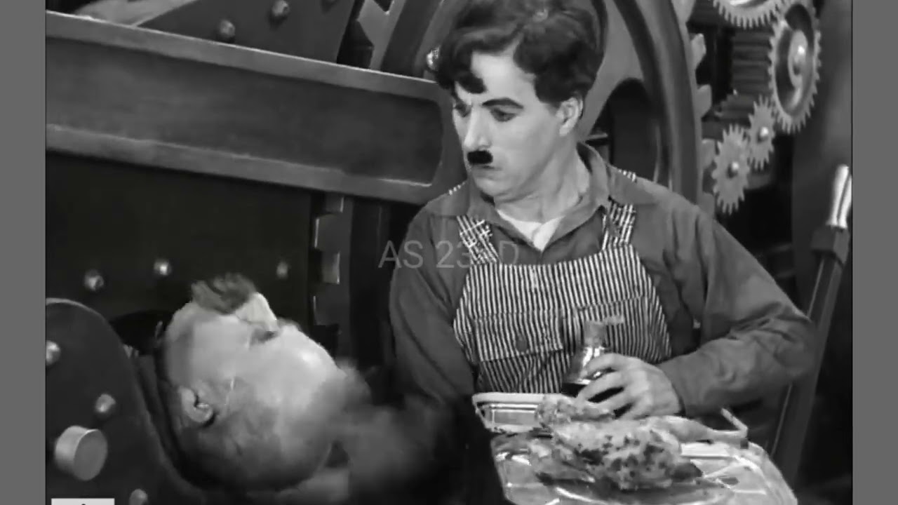 Charlie Chaplin and Chester Conklin in a scene from Modern Times (1936) © Roy Export S.A.S.