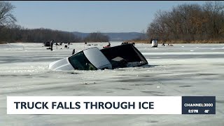 Truck falls through ice