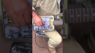 Waltzing Matilda, played on a guitar made from a biscuit tin! 😯🎶