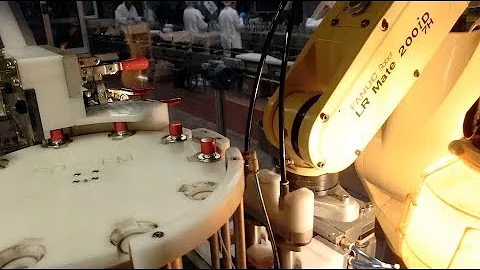 Robotic System for Picking, Placing & Crimping Spray Pumps On Cosmetics Bottles - Farason Corp.