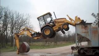 Backhoe loader self loading train