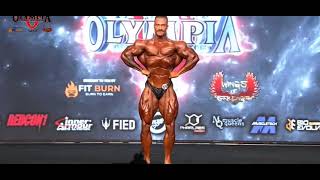 Chris bumstead posing at 2022 mr Olympia pre-judging