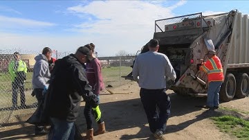 Excessive trash after holidays near homeless encampment prompts community clean up